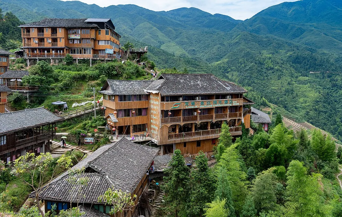 Wooden stilt guesthouses above the Longsheng rice terraces
